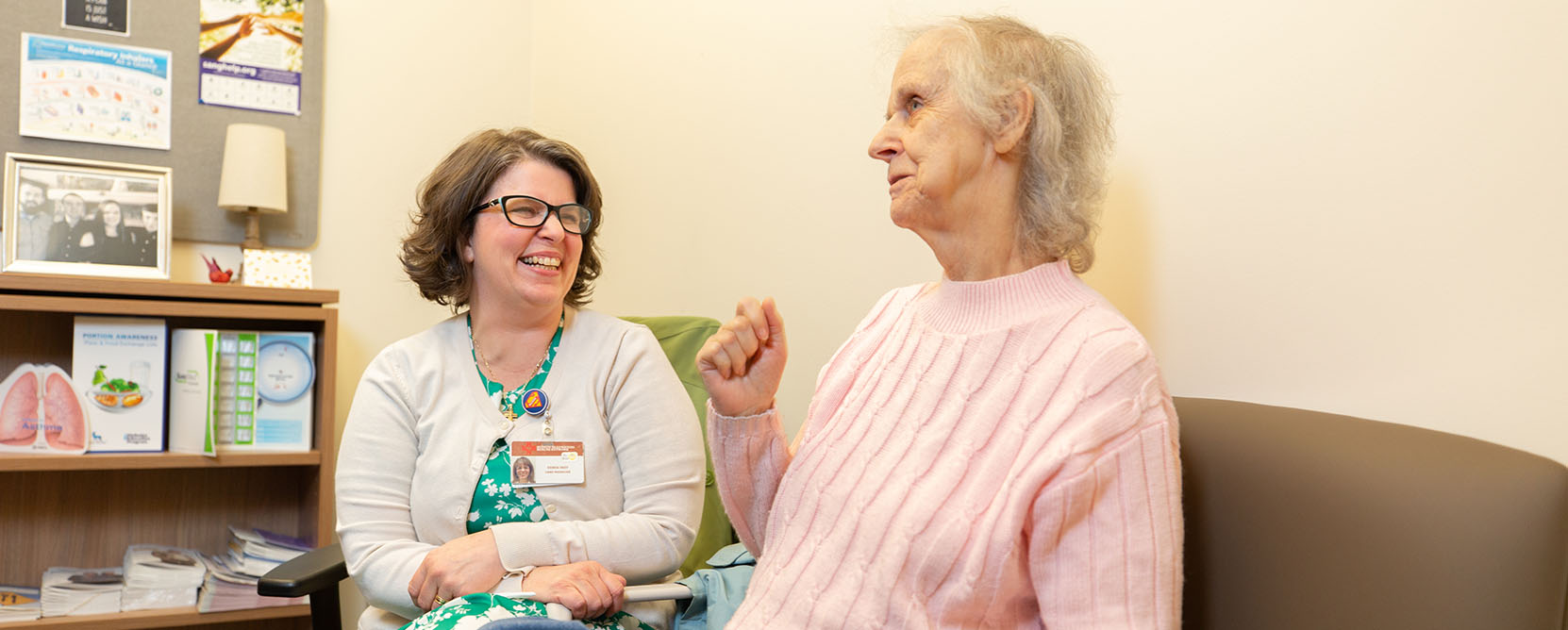 Older adult patient speaks with care manager